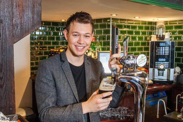 HAPPY HOUR: Kenny will be working this crimbo as his family live in Barbados [SWNS ] 